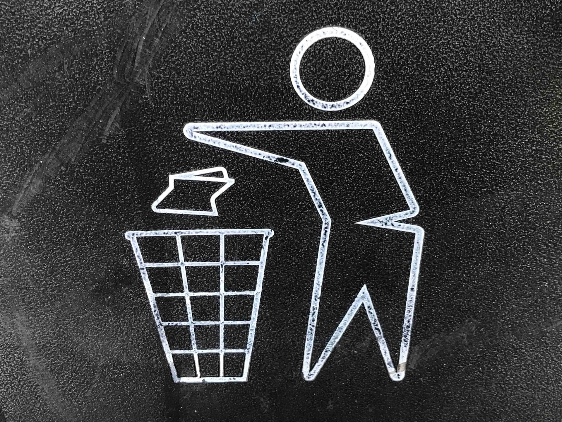 Close-up photo of a trash bin icon.