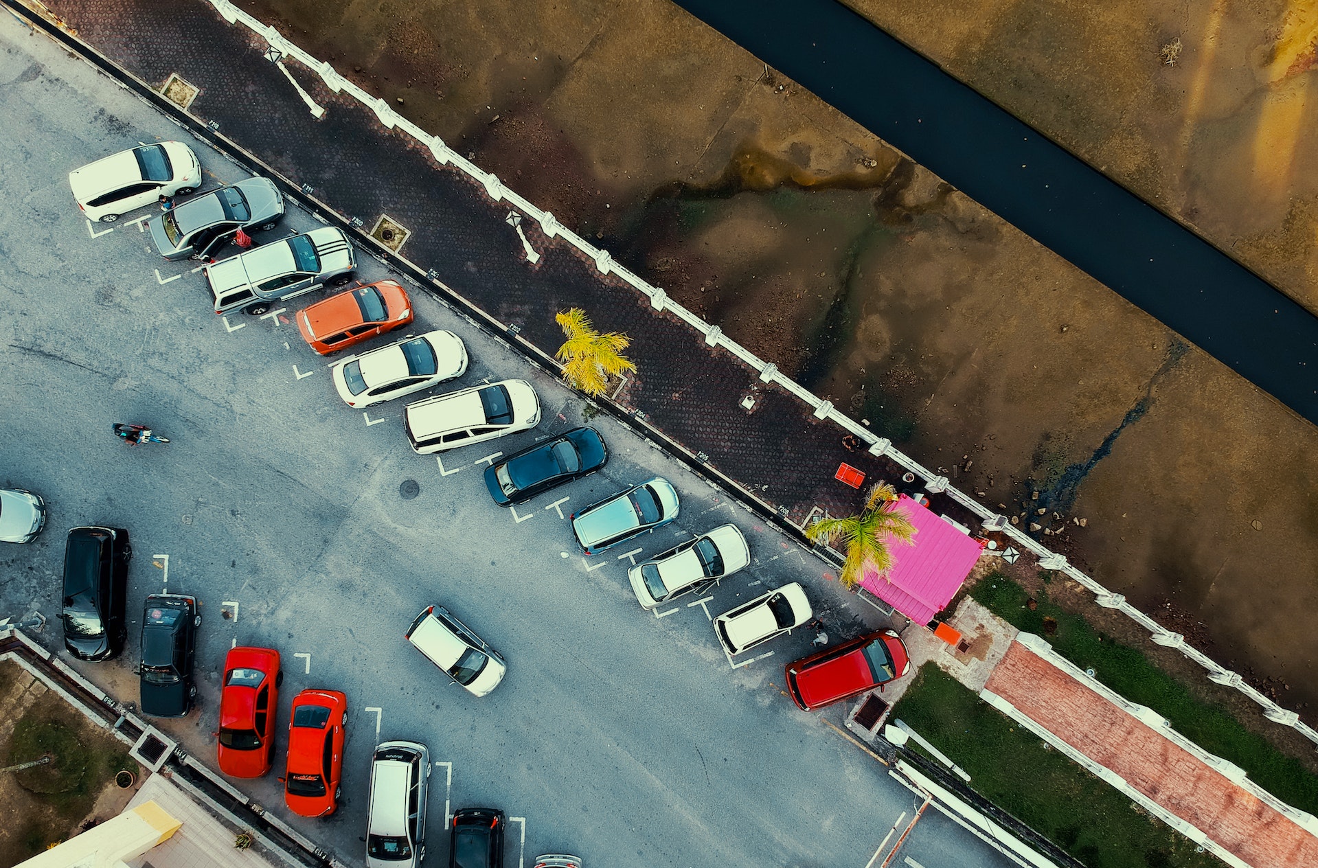 Aerial view of car looking for an open parking spot.